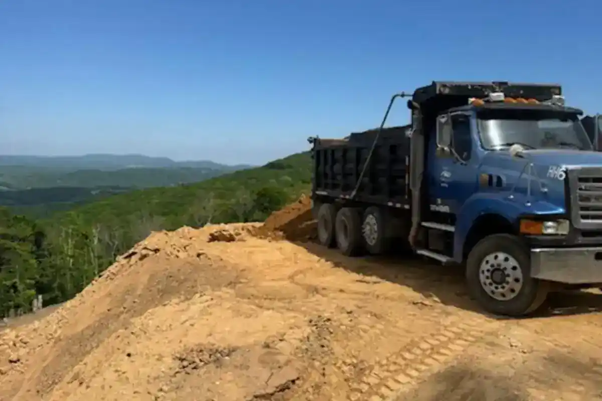 Dump truck positioned on a large grading project