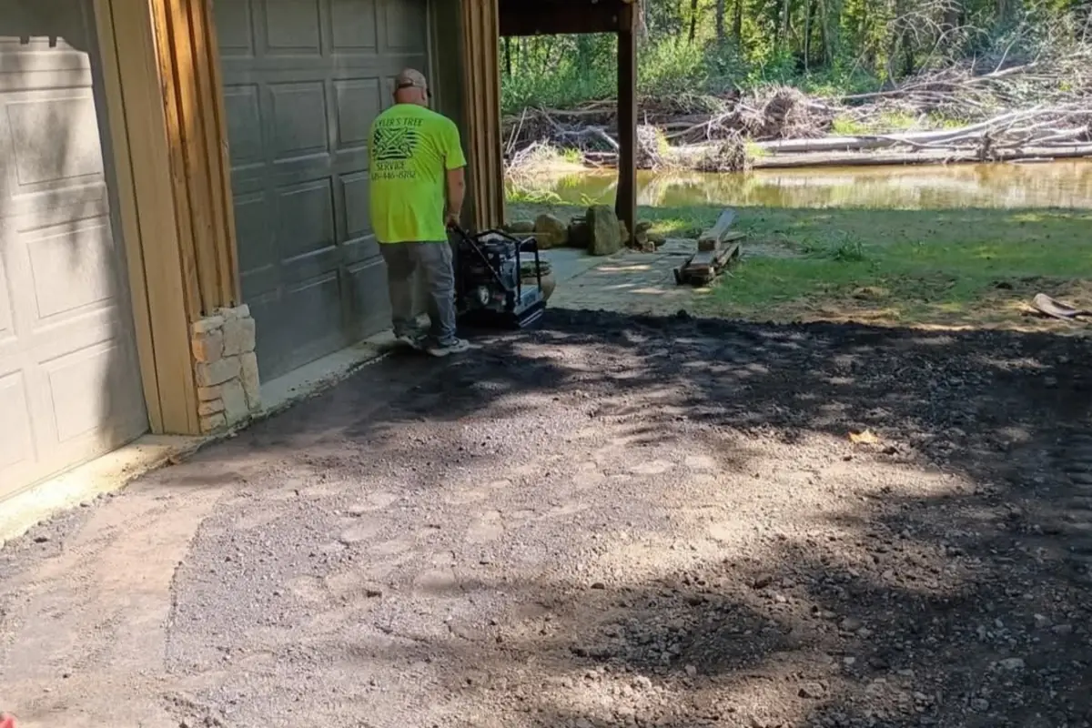 Finished grading beside a residential outbuilding